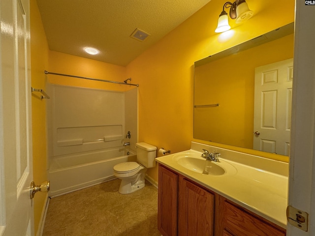 full bathroom featuring  shower combination, tile patterned flooring, a textured ceiling, toilet, and vanity