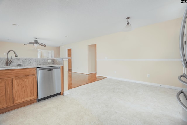 kitchen with sink, stainless steel dishwasher, ceiling fan, and light tile patterned flooring