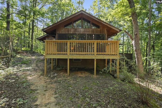 sunroom / solarium featuring ceiling fan, wood ceiling, and vaulted ceiling