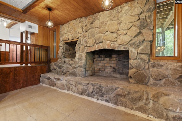 recreation room with a stone fireplace and ceiling fan