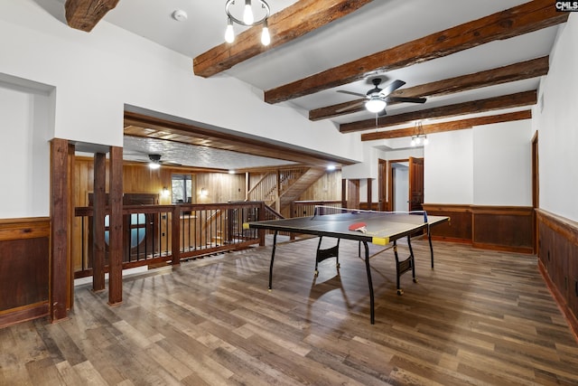 interior space featuring beam ceiling, ceiling fan, wooden walls, and tile patterned flooring