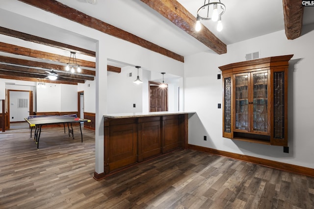 game room with wooden walls, ceiling fan, and wood-type flooring