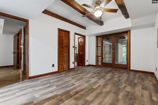 kitchen with beam ceiling, decorative light fixtures, ceiling fan, and dark wood-type flooring