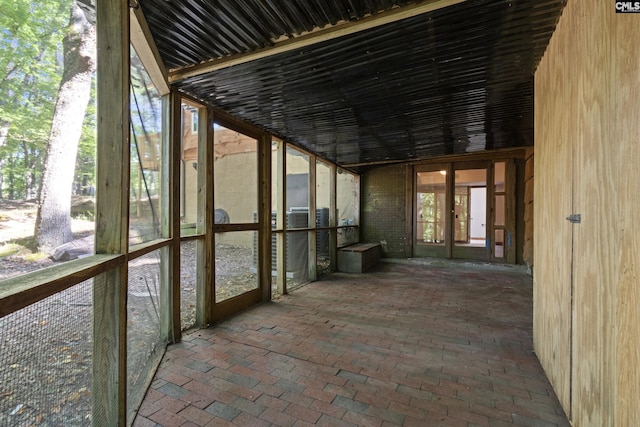 unfurnished sunroom featuring plenty of natural light