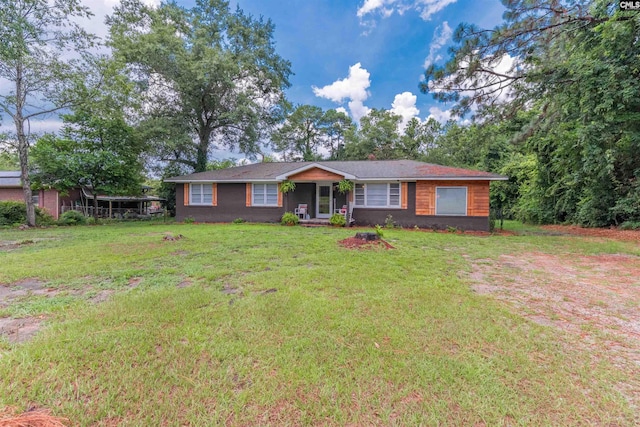 single story home with a front lawn