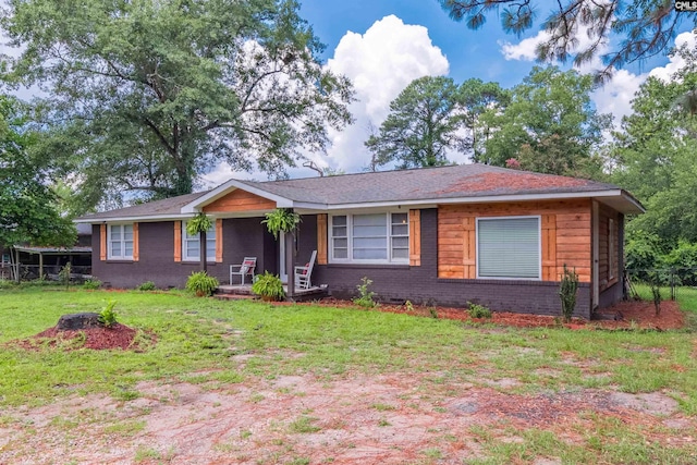 single story home featuring a front yard and covered porch