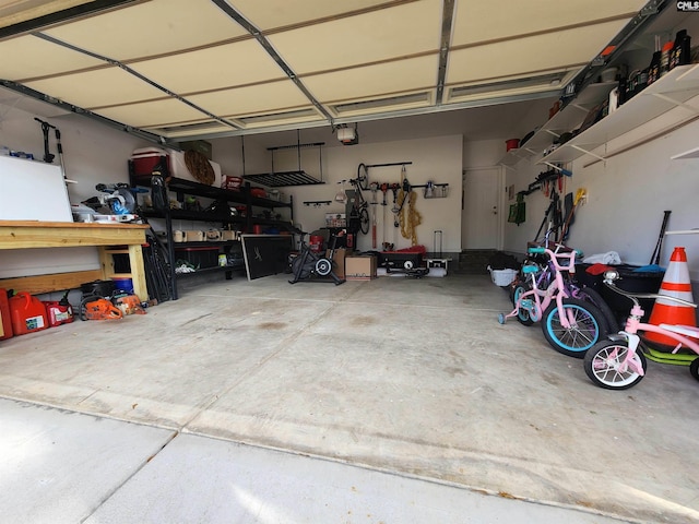 garage featuring a workshop area and a garage door opener