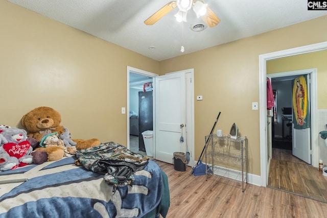 bedroom featuring ceiling fan and hardwood / wood-style floors