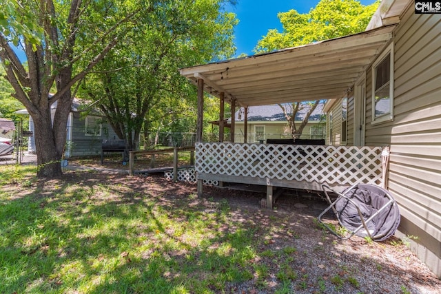 view of yard with a wooden deck