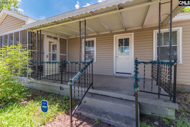 doorway to property featuring a porch