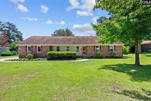 ranch-style house featuring a front lawn