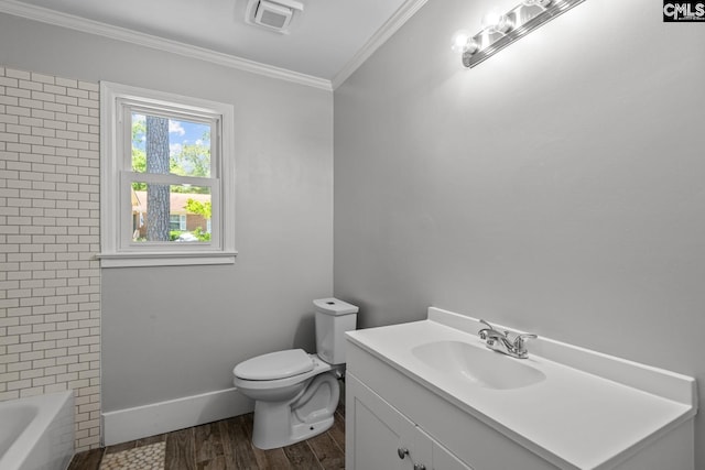 bathroom featuring vanity, crown molding, toilet, and hardwood / wood-style flooring