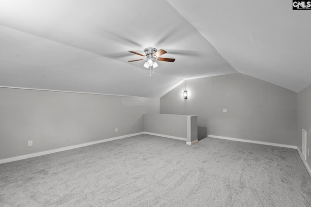 bonus room featuring ceiling fan, lofted ceiling, and carpet flooring