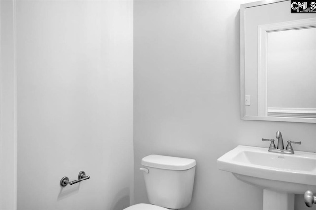 bathroom featuring a sink and toilet