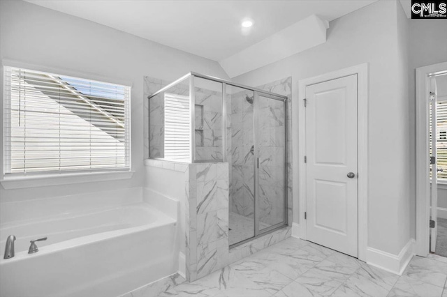 full bath with a marble finish shower, plenty of natural light, marble finish floor, and a garden tub