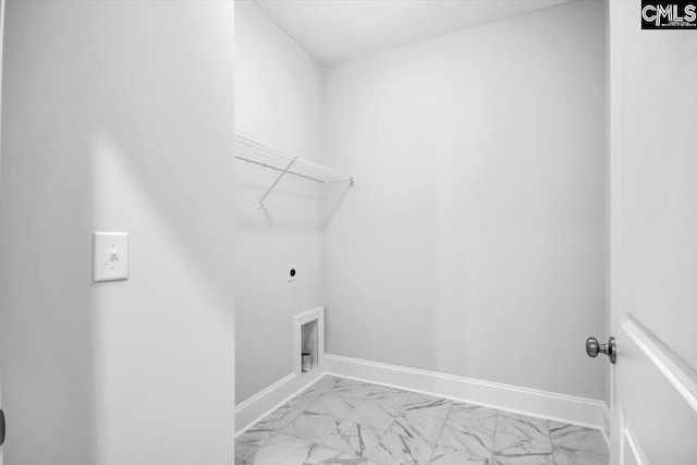 laundry area featuring baseboards, hookup for an electric dryer, marble finish floor, and laundry area