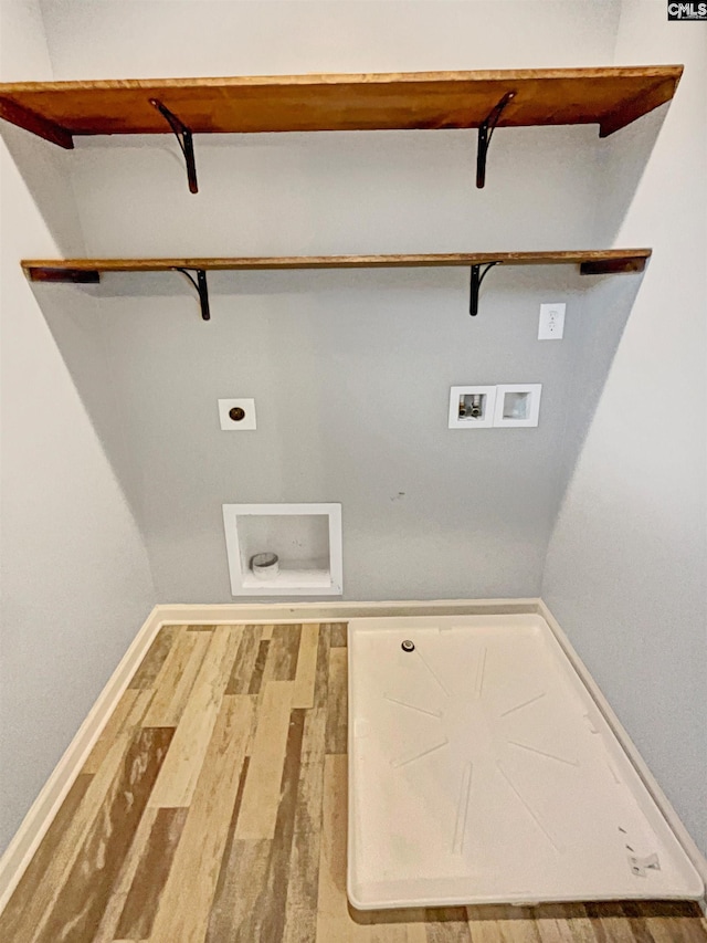 washroom with wood-type flooring, hookup for a washing machine, and hookup for an electric dryer