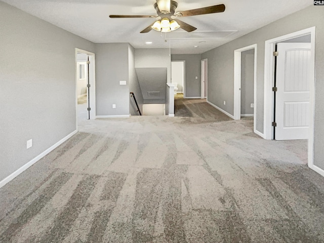 unfurnished living room with carpet floors and ceiling fan