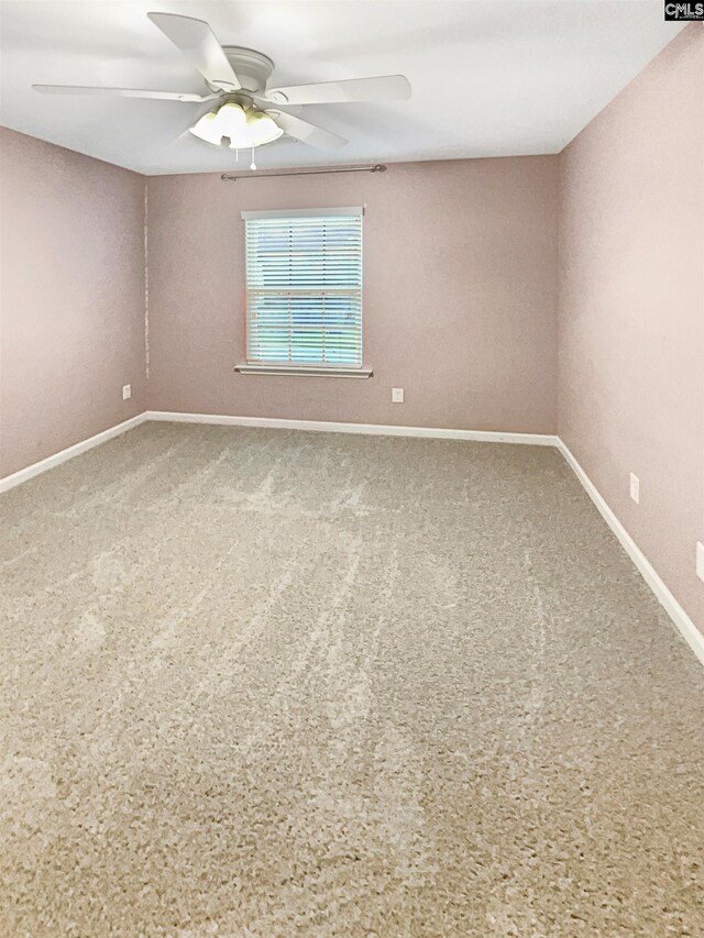 carpeted empty room with ceiling fan