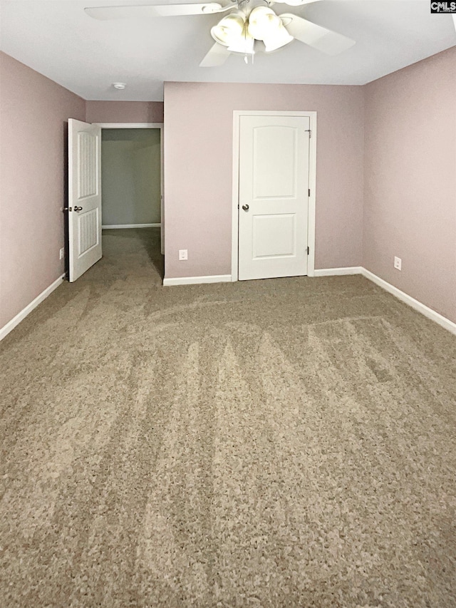 unfurnished bedroom with ceiling fan and carpet flooring