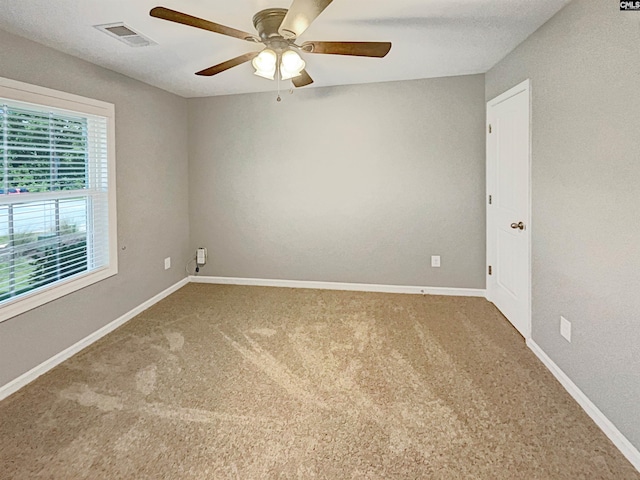 carpeted empty room with ceiling fan