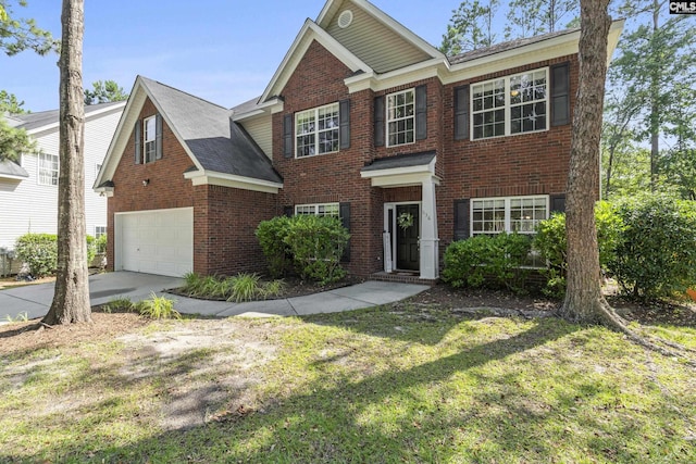 view of front of property featuring a front yard and a garage