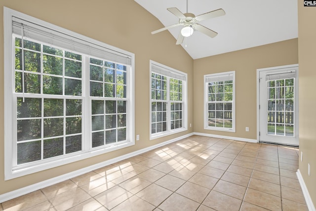 unfurnished sunroom with ceiling fan and vaulted ceiling