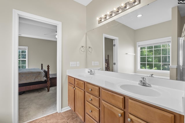 bathroom with tile patterned flooring, ceiling fan, and vanity