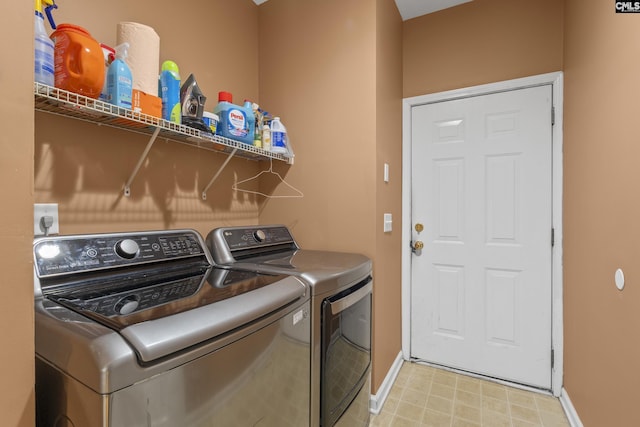 clothes washing area featuring washing machine and clothes dryer