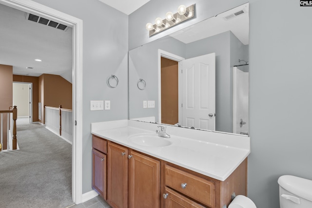 bathroom with vanity and toilet