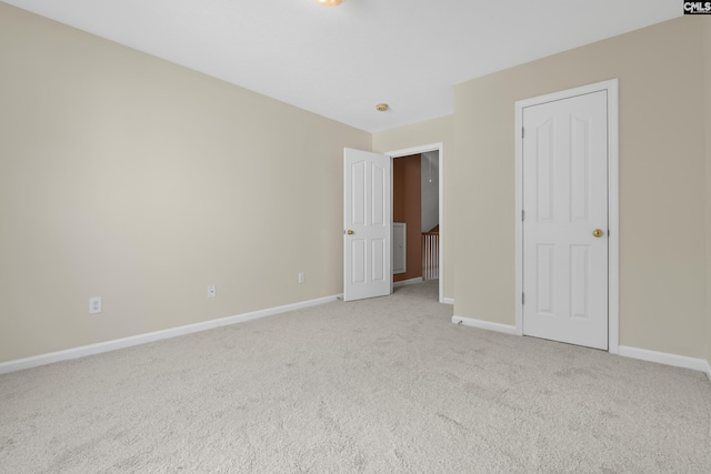 empty room featuring light colored carpet