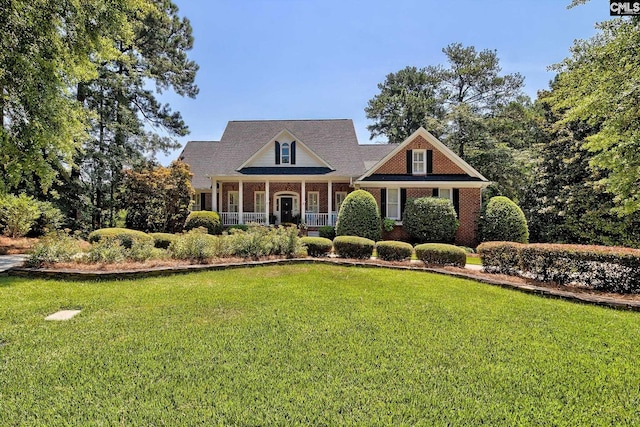 view of front of property with a porch and a front yard