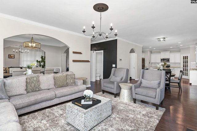 living area featuring dark wood-style floors, recessed lighting, a notable chandelier, and ornamental molding