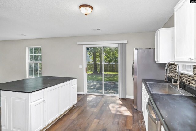 817 Wickham Ln, Columbia, SC 29229 - kitchen featuring decorative backsplash, a sink, and dark countertops