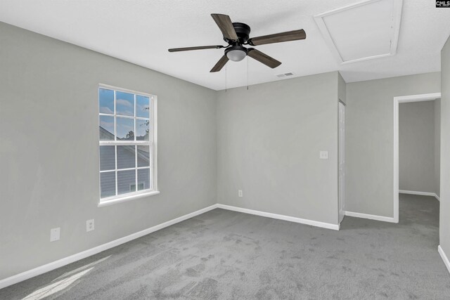 817 Wickham Ln, Columbia, SC 29229 - carpeted spare room with attic access, baseboards, visible vents, and a ceiling fan