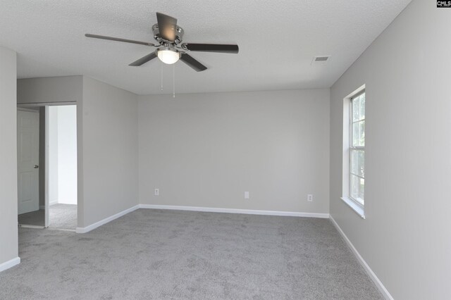 817 Wickham Ln, Columbia, SC 29229 - carpeted spare room featuring baseboards, a textured ceiling, visible vents, and a ceiling fan