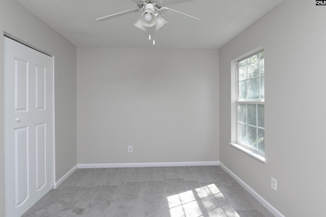 817 Wickham Ln, Columbia, SC 29229 - empty room featuring light carpet, baseboards, a textured ceiling, and a ceiling fan