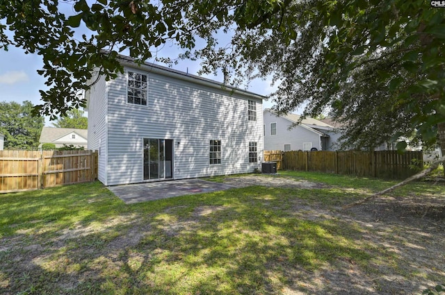 817 Wickham Ln, Columbia, SC 29229 - rear view of house featuring a lawn, central AC unit, a fenced backyard, and a patio