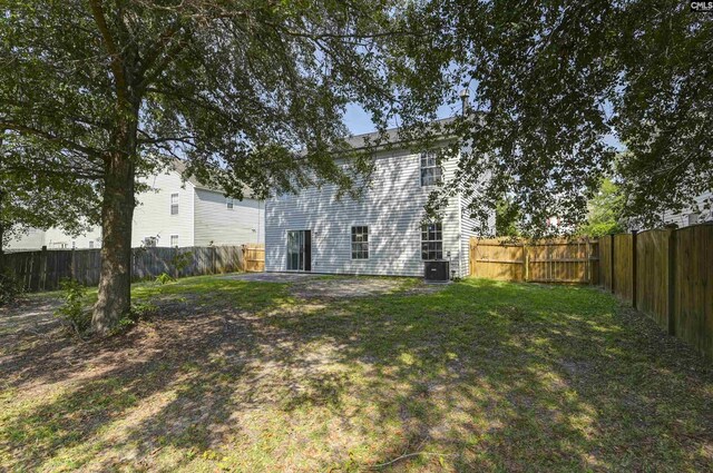 817 Wickham Ln, Columbia, SC 29229 - rear view of property with a patio, cooling unit, a yard, and a fenced backyard