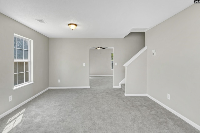 817 Wickham Ln, Columbia, SC 29229 - unfurnished room with baseboards, visible vents, stairway, and a ceiling fan