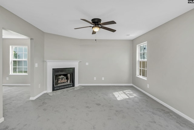 817 Wickham Ln, Columbia, SC 29229 - unfurnished living room with a fireplace with flush hearth, baseboards, carpet flooring, and a ceiling fan