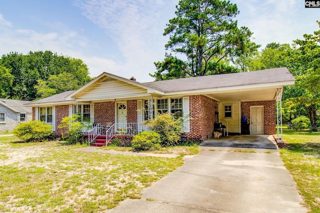 single story home with a front lawn, a carport, and covered porch