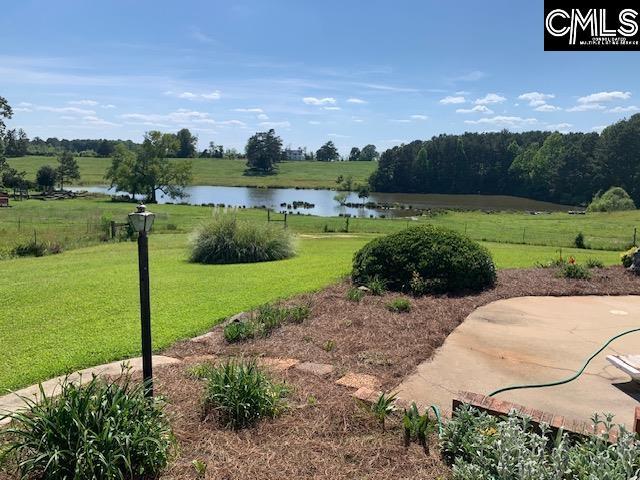 view of yard featuring a water view and a rural view