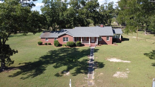 single story home with a front lawn and a porch