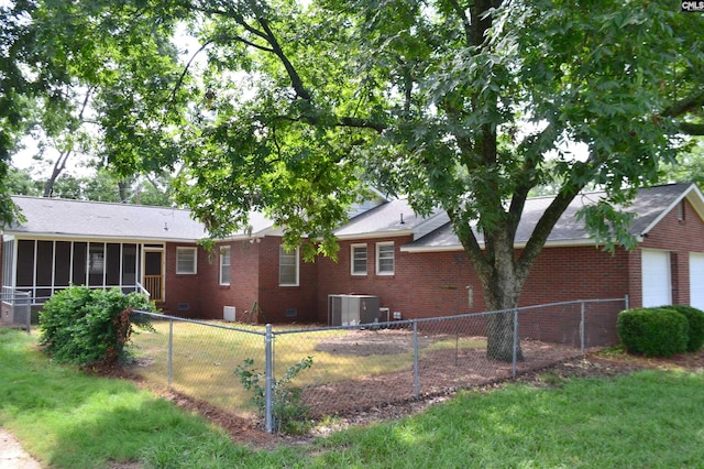 view of yard featuring cooling unit and a sunroom