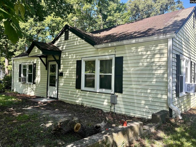 view of front of home with cooling unit