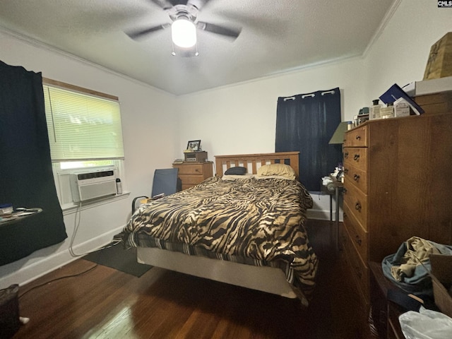 bedroom with cooling unit, dark wood-type flooring, ornamental molding, and ceiling fan