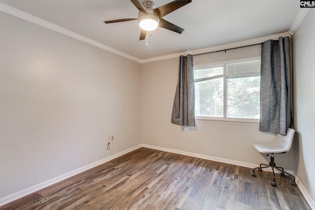 spare room featuring ceiling fan, dark wood-type flooring, and ornamental molding