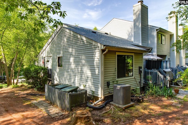 view of home's exterior with central air condition unit