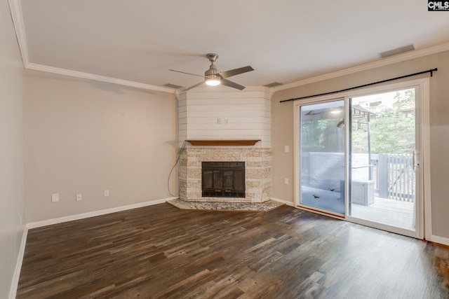 unfurnished living room with ceiling fan, a fireplace, dark hardwood / wood-style flooring, and crown molding